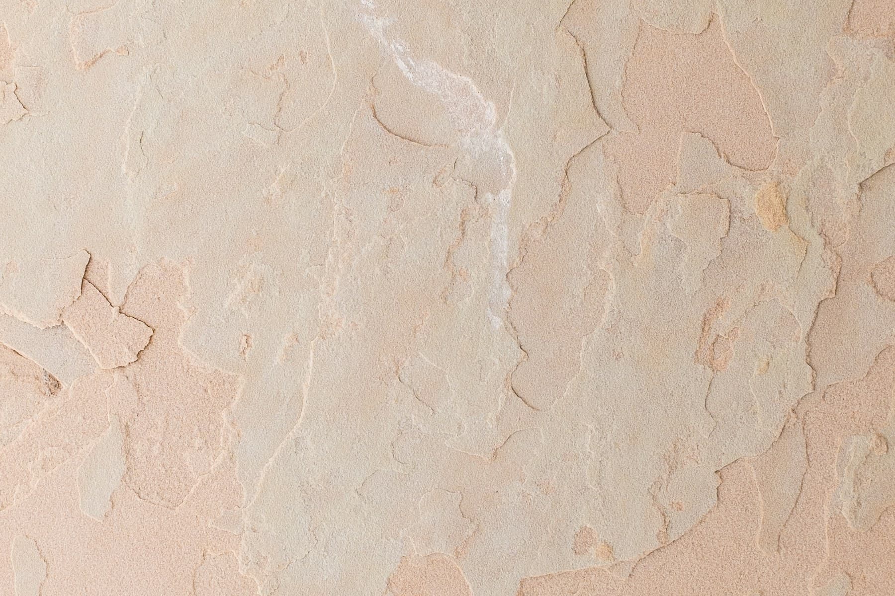 A close view of a warm plaster surface.