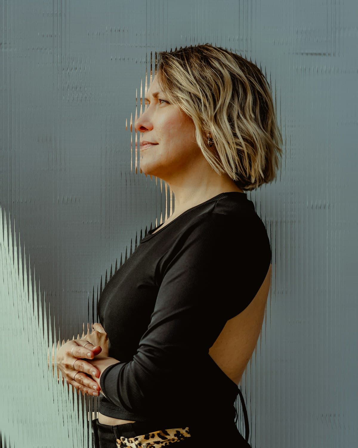 Dr. Elena Vogt, photographed against a pale studio wall.